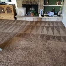 Detailed view of carpet cleaning wand extracting dirt from carpet during hot water extraction